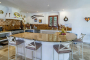 The kitchen has a large gas cooker and 2 ovens